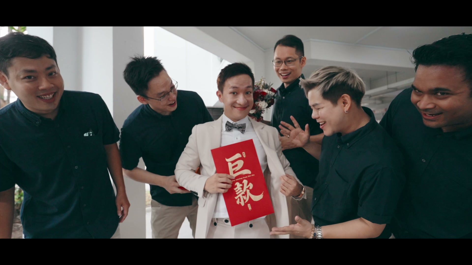 A groom celebrating with family and friends